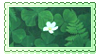 Stamp of a small white flower in a field of clovers